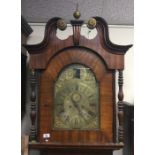 A large mahogany Grandfather clock with brass dial