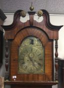 A large mahogany Grandfather clock with brass dial