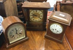 Three old mantle clocks.