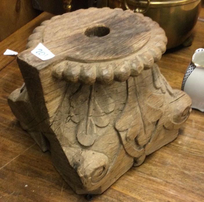 A rustic oak column mount.