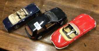 Three large toy cars.