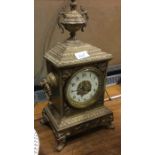 A brass mounted mantle clock.