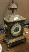 A brass mounted mantle clock.