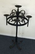 A wrought iron candle holder.