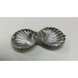 A hinged top silver box in the form of an oyster.