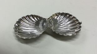 A hinged top silver box in the form of an oyster.