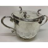 An early style silver porringer and stand. Britann