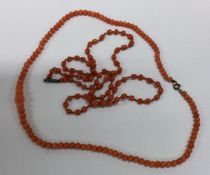 Two Antique strings of coral beads. Est. £20 - £30