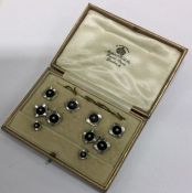 A good set of 9 carat onyx and pearl cufflinks tog