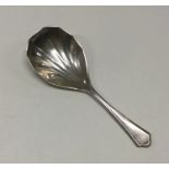 A silver caddy spoon with fluted bowl. Birmingham