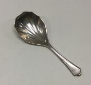 A silver caddy spoon with fluted bowl. Birmingham