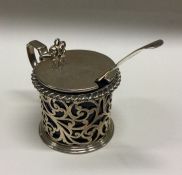 A Victorian silver mustard pot with pierced decora