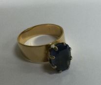 A French sapphire single stone ring in claw mount.