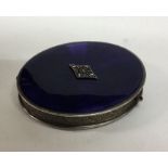 A silver and enamel hinged top box with central pl