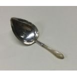 A George III silver and MOP caddy spoon. Birmingha