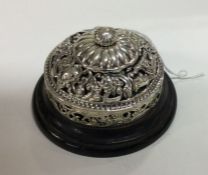 A Victorian chased silver table bell with pierced