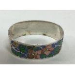 A silver and enamel napkin ring. Birmingham 1929.