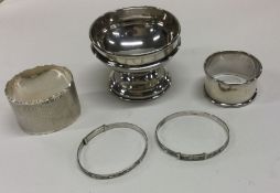 A small silver pedestal bowl together with napkin