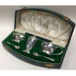 A good cased silver three piece Art Deco cruet. Lo