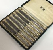 A group of silver handled cased knives. Est. £20 -
