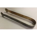 A pair of bright cut George III silver ice tongs w
