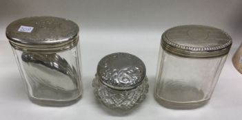 A group of silver mounted glass dressing table jar