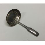 A George III silver caddy spoon with basket weave