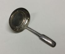 A George III silver caddy spoon with basket weave