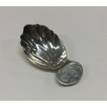 A George III silver caddy spoon with fluted bowl t
