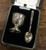 A cased silver egg cup together with matching spoo