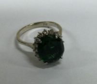 A good diamond and tourmaline cluster ring in 18 c
