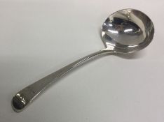 A Georgian silver sauce ladle. London. By GS. Appr