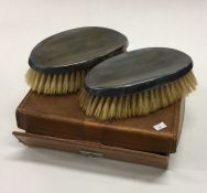 A heavy pair of silver clothes brushes. Est. £20 -