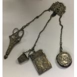 A silver plated chatelaine decorated with cherubs.