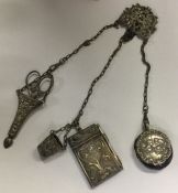 A silver plated chatelaine decorated with cherubs.