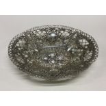 HAZORFIM: A silver fruit dish chased with fruit an