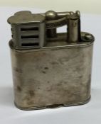 DUNHILL: A plated lighter of typical form. Est. £3