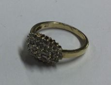 A 9 carat diamond cluster ring in claw mount. Appr