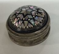A heavy silver and MOP box with hinged top. Approx