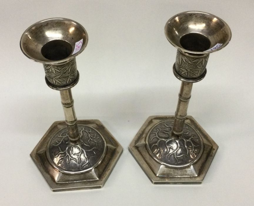 WANG HING: A decorative pair of Chinese silver can - Image 2 of 3