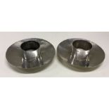 A Modernistic pair of silver candle / chamberstick