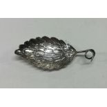 A 19th Century silver caddy spoon with feathered w