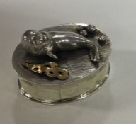 A silver box with chased seal decoration. London 1