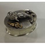 A silver box with chased seal decoration. London 1