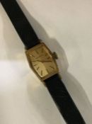 MARVIN: A lady's 9 carat gold wristwatch on leathe