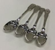 A collection of four various silver dessert spoons