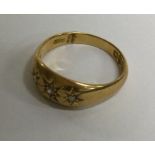 An 18 carat gold diamond three stone ring. Approx.