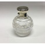 A silver mounted glass scent bottle. London 1926.