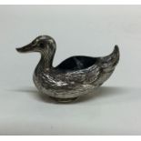 A silver pin cushion in the form of a duck. Marked