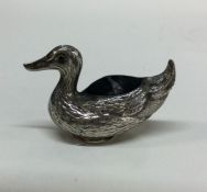 A silver pin cushion in the form of a duck. Marked